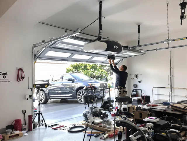 Huntersville Garage Door Repair specialist installing smart garage door opener system in Huntersville home