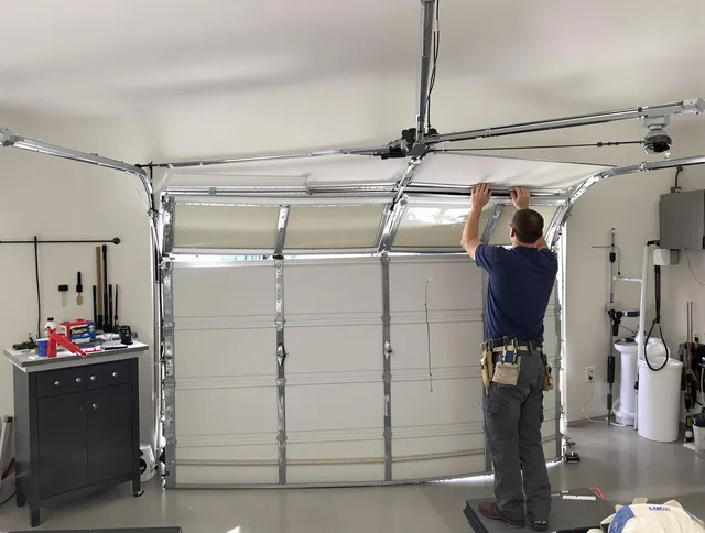 Huntersville Garage Door Repair specialist performing precise section replacement on Huntersville garage door
