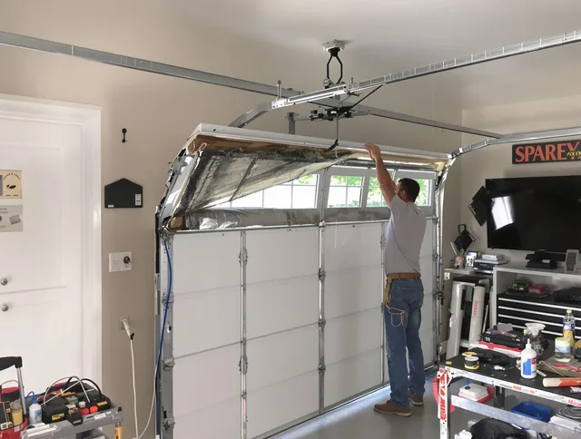 Garage door section replacement by Huntersville Garage Door Repair in Huntersville