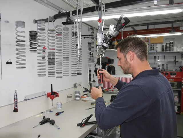 Huntersville Garage Door Repair safety certified technician performing precision spring replacement in Huntersville