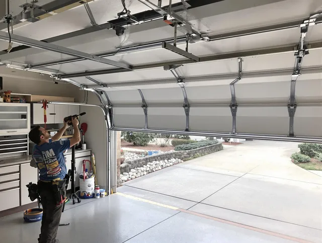 Garage door track repair service by Huntersville Garage Door Repair in Huntersville